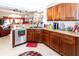 Kitchen boasts ample counter space, wood cabinets, and stainless steel appliances at 12528 Roseland Dr, New Port Richey, FL 34654