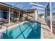 Refreshing pool area with patio furniture at 12528 Roseland Dr, New Port Richey, FL 34654