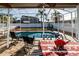 Covered patio with pool and dining furniture at 12528 Roseland Dr, New Port Richey, FL 34654