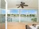 Screened porch overlooking water with wicker chairs at 3241 Spanish Bayonet Dr, Hernando Beach, FL 34607