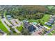 Aerial view of community with clubhouse, pool, tennis courts, and golf course at 10516 Moshie Ln, San Antonio, FL 33576