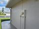 Exterior wall with electrical box and meter at 10516 Moshie Ln, San Antonio, FL 33576