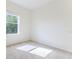 Well-lit bedroom with neutral walls and carpeted floor at 109 Fairmont Dr, Spring Hill, FL 34609