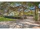 Spacious front yard with mature trees and landscaping at 2303 S Hesperides St, Tampa, FL 33629