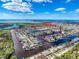 Aerial view showcasing the home's waterfront location and surrounding community at 12637 2Nd Isle, Hudson, FL 34667
