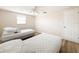 Spacious bedroom with twin beds, ceiling fan, and closet at 12637 2Nd Isle, Hudson, FL 34667