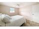 Bright bedroom with a double bed, ceiling fan, and window coverings at 12637 2Nd Isle, Hudson, FL 34667