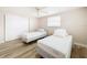 Bedroom with two twin beds, ceiling fan and closet at 12637 2Nd Isle, Hudson, FL 34667