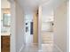 Bright hallway with views into the living room and bathroom at 12637 2Nd Isle, Hudson, FL 34667