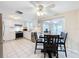 Modern white kitchen with stainless steel appliances and a breakfast bar at 12637 2Nd Isle, Hudson, FL 34667