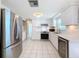 Bright kitchen with stainless steel appliances and white cabinets at 12637 2Nd Isle, Hudson, FL 34667
