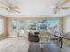 Sunroom featuring water views and comfortable seating at 12637 2Nd Isle, Hudson, FL 34667