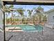 Relaxing screened pool area with waterfall feature at 18134 Powerline Rd, Dade City, FL 33523