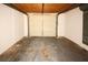 Empty garage with overhead door and concrete floor at 3605 Richboro Dr, Holiday, FL 34691