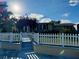 Cute home with white picket fence and landscaped yard at 1354 Linstock Dr, Holiday, FL 34690