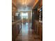 Open kitchen with wood cabinets and granite countertops at 1354 Linstock Dr, Holiday, FL 34690
