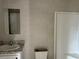 Bathroom with single vanity, shower, and vinyl flooring at 1925 Patriot Ln, Holiday, FL 34690