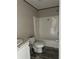 Clean bathroom featuring a shower/tub combo and granite vanity at 1925 Patriot Ln, Holiday, FL 34690