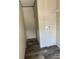 Small laundry room with shelving and hookups for washer/dryer at 1925 Patriot Ln, Holiday, FL 34690