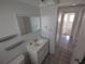 Bathroom with vanity, toilet, and tile floor at 7552 Cumber Dr, New Port Richey, FL 34653