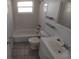 Bathroom view featuring a bathtub, sink, and toilet at 7552 Cumber Dr, New Port Richey, FL 34653