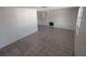 Bright living room featuring neutral walls and tile flooring, offering versatility for decor styles at 7552 Cumber Dr, New Port Richey, FL 34653