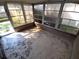 Enclosed sunroom with concrete flooring at 7552 Cumber Dr, New Port Richey, FL 34653