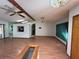 Spacious living room with hardwood floors and fireplace at 1000 Godfrey Ave, Spring Hill, FL 34609