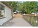 Spacious deck with wooden railings, offering backyard views at 2449 16Th N St, St Petersburg, FL 33704