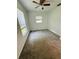 Well-lit bedroom featuring carpet flooring at 27173 Simona Ave, Brooksville, FL 34602