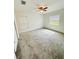 Spacious bedroom with gray carpet and large window at 27173 Simona Ave, Brooksville, FL 34602