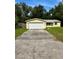 House exterior with attached garage at 27173 Simona Ave, Brooksville, FL 34602