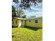 Newly renovated home with green lawn at 27173 Simona Ave, Brooksville, FL 34602