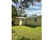 Newly renovated home with green lawn at 27173 Simona Ave, Brooksville, FL 34602