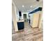 Modern kitchen with white cabinets, white appliances, and a stylish sink at 27173 Simona Ave, Brooksville, FL 34602