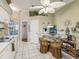 Kitchen breakfast nook with a glass table and wicker chairs at 11654 Holly Ann Dr, New Port Richey, FL 34654