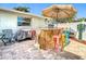 Outdoor area featuring an outdoor kitchen, bar, grill, and various seating arrangements at 12832 3Rd Isle, Hudson, FL 34667