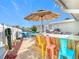 Outdoor kitchen and bar area for outdoor relaxation and entertaining at 12832 3Rd Isle, Hudson, FL 34667