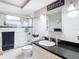 Clean bathroom features modern fixtures, a glass-enclosed shower, and a granite countertop at 12832 3Rd Isle, Hudson, FL 34667