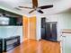 Bedroom with a ceiling fan and laminate flooring at 12832 3Rd Isle, Hudson, FL 34667