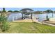 This dock features a covered boat lift for easy water access and protection at 12832 3Rd Isle, Hudson, FL 34667