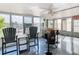 This enclosed patio features bright natural light and views of the canal behind the home at 12832 3Rd Isle, Hudson, FL 34667