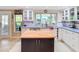 Beautiful kitchen with a butcher block island, white cabinets and stainless steel appliances at 12832 3Rd Isle, Hudson, FL 34667