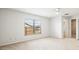 Spacious bedroom with large window and ceiling fan at 2027 Beckwith Ave, Spring Hill, FL 34608