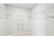Walk-in closet with wire shelving for ample storage at 2027 Beckwith Ave, Spring Hill, FL 34608