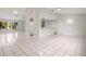 Open kitchen with white appliances and breakfast bar at 2027 Beckwith Ave, Spring Hill, FL 34608