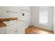 Laundry room with sink, cabinets, and shelving unit at 2027 Beckwith Ave, Spring Hill, FL 34608
