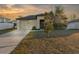 One-story home with attached garage and landscaped yard at 26416 Mcallister St, Brooksville, FL 34602