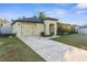 House exterior with a two-car garage and well-maintained lawn at 26416 Mcallister St, Brooksville, FL 34602