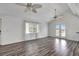 Spacious living area featuring hardwood floors and water views at 3465 Gulf Coast Dr, Hernando Beach, FL 34607